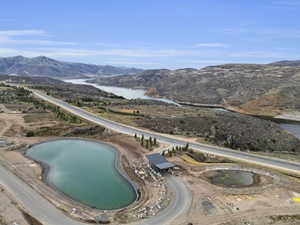 View of swimming pool with a water and mountain view