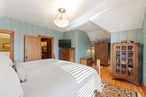 Primary Bedroom with hardwood  flooring