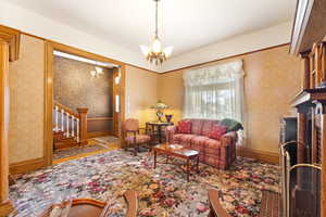 Living room featuring a chandelier