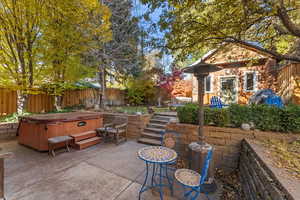 View of patio / terrace with a hot tub