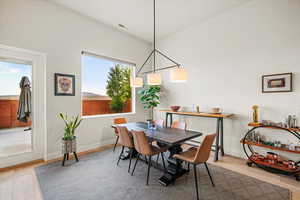 Dining space with wood-type flooring