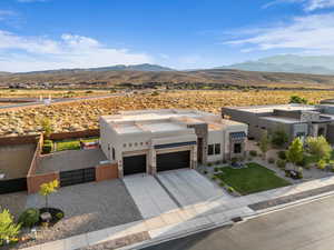 View of front of property featuring a mountain view and a garage