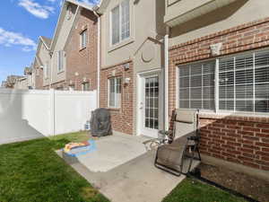 View of fenced in patio featuring grilling area