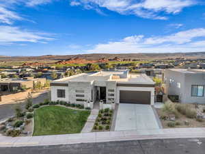 View of front of house featuring a mountain view and a garage