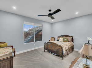 Bedroom featuring ceiling fan and light colored carpet