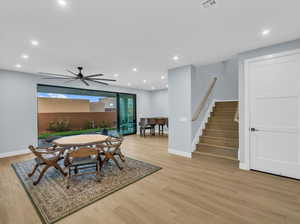 Dining space with light wood-type flooring and ceiling fan