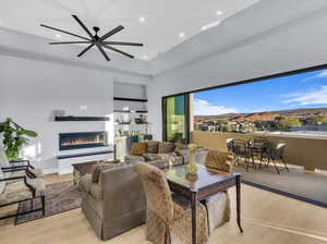 Living room featuring light hardwood / wood-style floors and ceiling fan