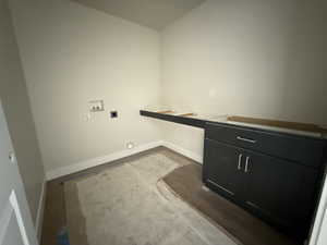 Laundry area with laundry area, washer hookup, electric dryer hookup, and baseboards