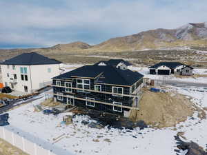 Snowy aerial view with a mountain view