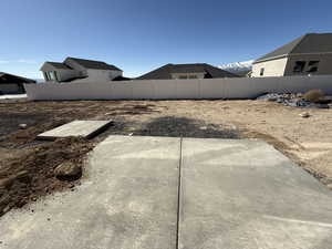 View of yard featuring fence