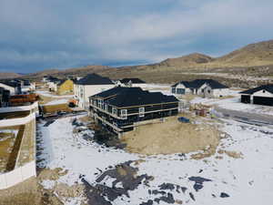 Snowy aerial view featuring a mountain view