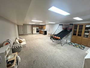 Game room featuring light carpet