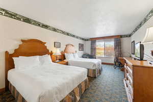Bedroom featuring a textured ceiling