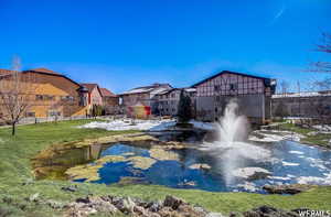 View of home's community featuring a yard