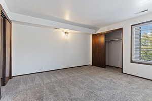 Unfurnished bedroom featuring carpet floors