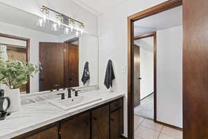 Bathroom featuring vanity and tile patterned floors