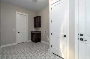 Laundry room featuring cabinets and hookup for a washing machine