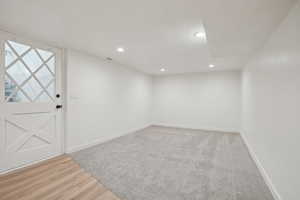 Spare room featuring light wood-type flooring