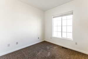 View of carpeted spare room