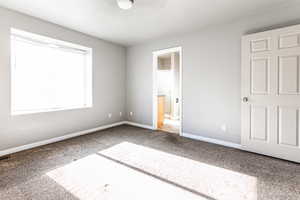 Unfurnished bedroom with carpet