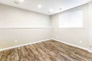 Spare room featuring hardwood / wood-style flooring