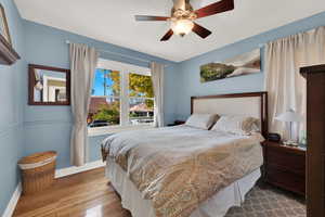 Bedroom with ceiling fan and light hardwood / wood-style floors