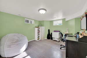 Carpeted office with a textured ceiling