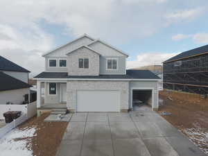 View of front of home featuring a garage