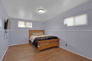 Bedroom with wood-type flooring