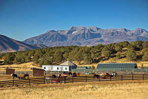 Property view of mountains with a rural view