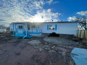 View of front of home with a deck