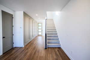 Corridor with dark wood-type flooring