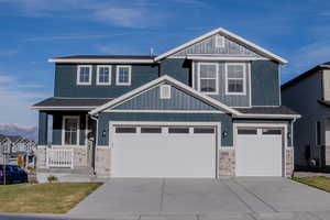 Craftsman house featuring a mountain view and a garage