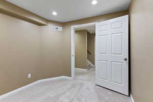 Interior space featuring light colored carpet