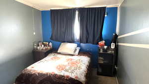 Bedroom featuring ornamental molding