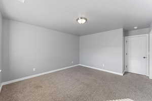 Spare room with carpet flooring