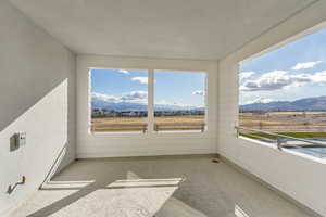 Sky-balcony featuring a mountain and waterfront view