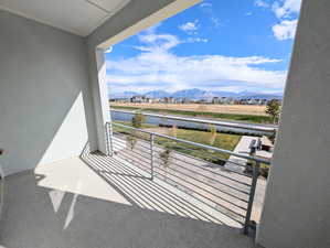 Primary bedroom private balcony with a mountain view