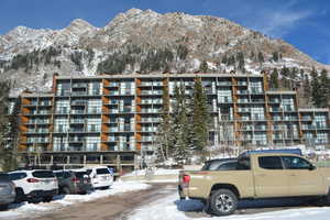 Snow covered property featuring a mountain view