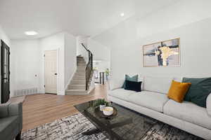 Living room with hardwood / wood-style floors