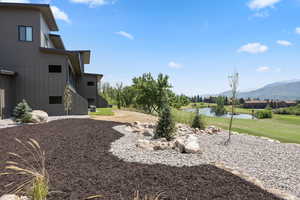 View of yard with a water and mountain view