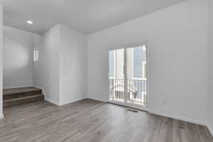 Unfurnished room featuring light wood-type flooring