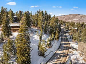 Snowy aerial view featuring a mountain view