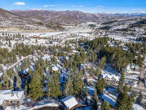 Snowy aerial view with a mountain view