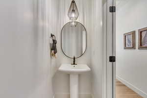 Bathroom with hardwood / wood-style floors