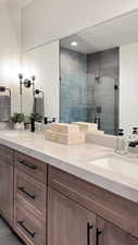 Bathroom with vanity and an enclosed shower