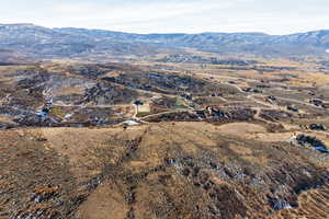 Birds eye view of property with a mountain view