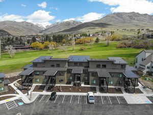 Bird's eye view featuring view of golf course and a mountain view