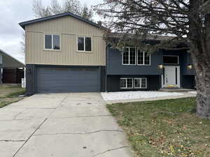 Raised ranch featuring a garage