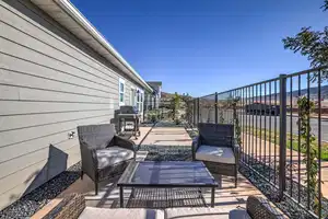 View of patio with a grill